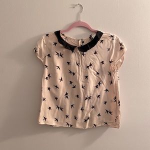 Collared birdie blouse.